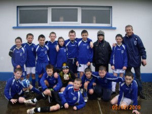 U11's v Listowel Celtic soaked but happy!