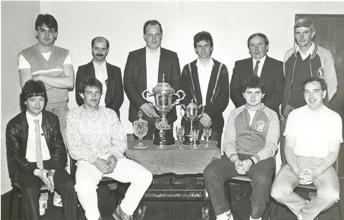 Killarney Athletic’s 1985 committee pictured with seven-a-side trophies